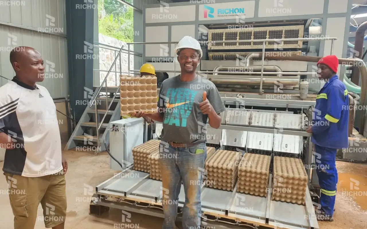 REM6-8 egg tray machine installed in Cameroon in 2023, producing 6,300 pieces per hour with local recycled materials for sustainable poultry packaging