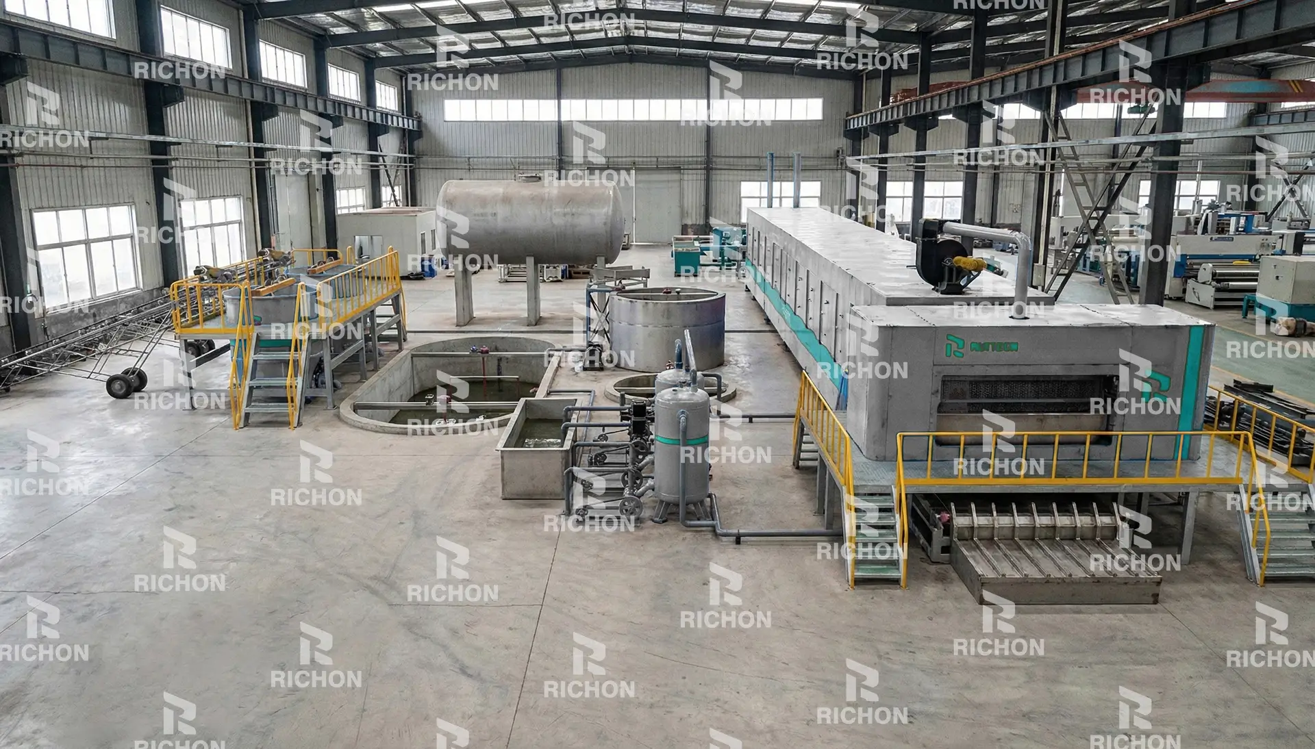 Factory workshop view of a fully automatic pulp molding production line with integrated drying system, showing forming machines, drying tunnel and material handling layout.