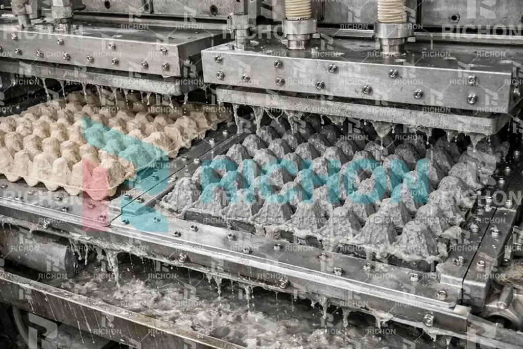 vacuum forming molds shaping wet egg trays from pulp slurry during pulp molding process