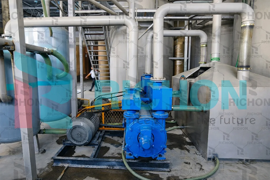 egg-tray-vacuum-pump-and-motor Illustrative pump, electric motor and pipework in an egg tray production facility